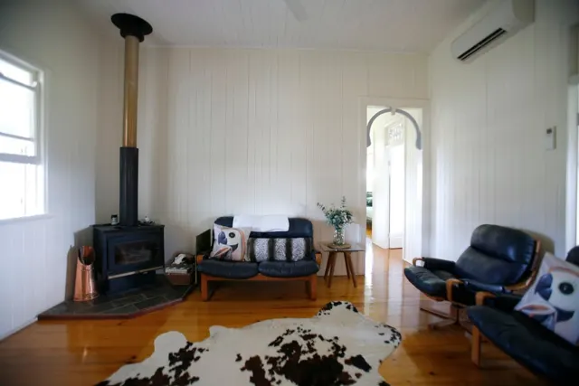 A cosy living room and wood-burning fireplace