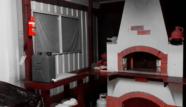 The pizza oven in the rustic shed