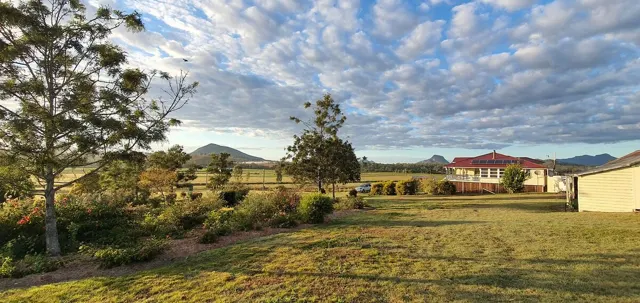 The farmhouse across the lawns