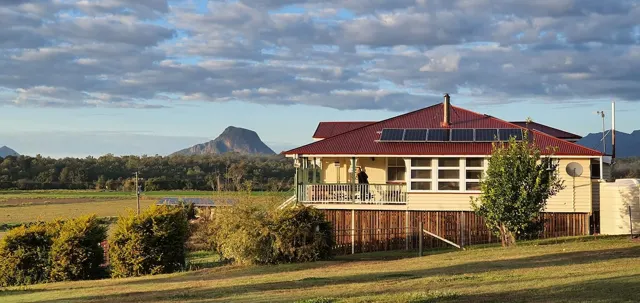 The Queenslander and its mountain backdrop