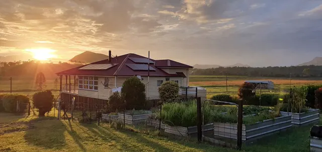Golden light across the farmhouse
