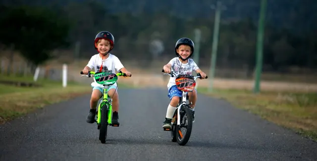Children riding bikes in the country