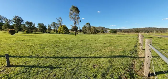 The rural setting beyond the fence