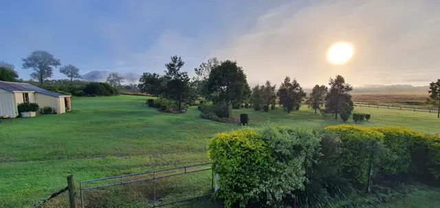 The sun above the country horizon