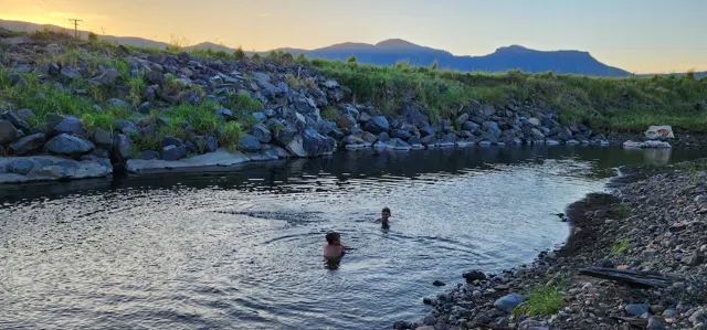 Children enjoying a swim in the creek