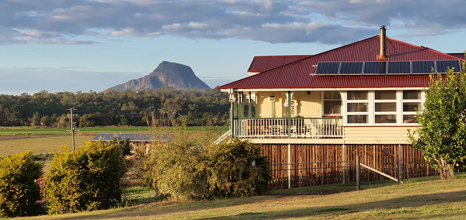 The farmhouse and mountains